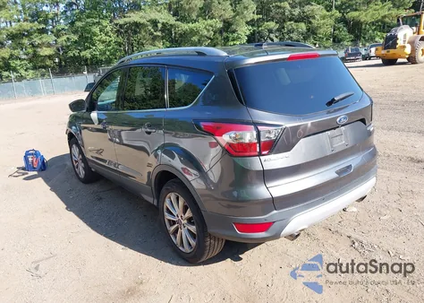 2017 Ford Escape Titanium z USA, uszkodzony, nr VIN 1FMCU0J97HUC92616